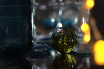glass ball among the glare, reflections and lights