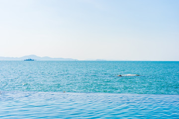 Fototapeta na wymiar Outdoor swimming pool with sea ocean view