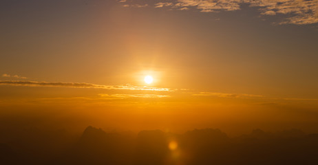 Sunrise landscape with hazy mountain ,clear sky in the morning and light flare.