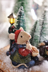 Christmas decoration with winter scene with mouse figurine