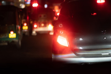 Obraz na płótnie Canvas Night road in the city of lights cars traffic jams