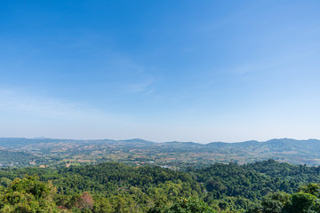 beautiful blue sky high peak mountains mist fog wildlife green forest at Khao Koh Phu Tub Berk Phetchabun Thailand guiding idea long weekend for backpacker camping campfire relaxing hiking  