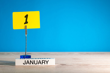 January 1st. Day 1 of january month, calendar on blue background. Winter time. Empty space for...