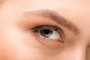 cropped view of young woman looking at camera