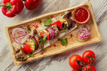 Georgian dish on the table photo for the menu of Eastern Caucasian cuisine. Grilled vegetables.