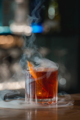 Boulevardie cocktail on a bar desk. Bright background