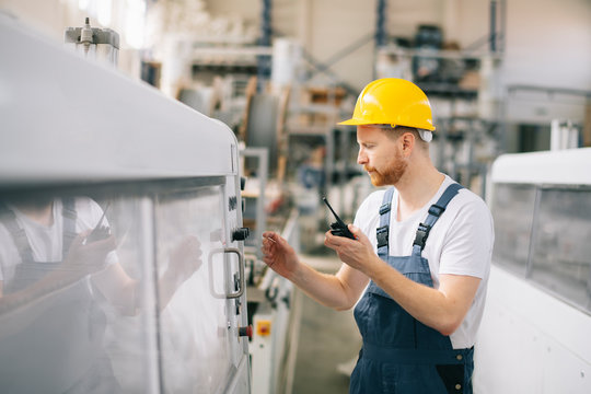 Factory worker with talkie walkie. 