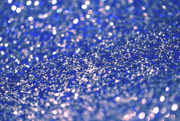 Beutiful festive background, shallow depth of field. Color of the year 2020 concept, classic blue colored trend for your design. Copy space. COY2020. Amazing shining glitter sparkles for cards, design
