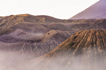 View from above, stunning close-up view of the Mount bromo crater and the Mount Batok surrounded by...