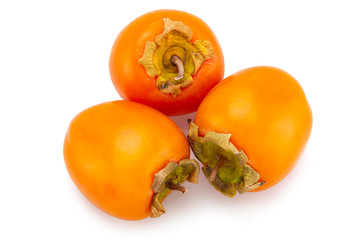 fresh ripe persimmons with leaf isolated on white background. full depth of field