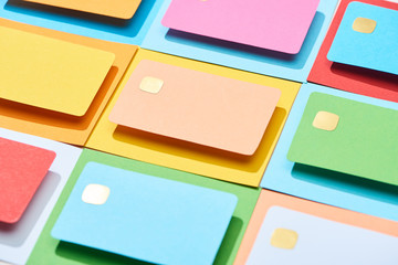 multicolored empty credit cards on colorful background