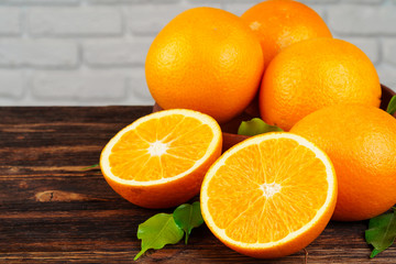 Sliced into pieces juicy ripe oranges close up