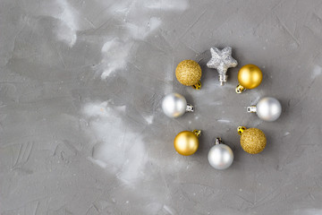 gold and silver balls and stars laid out in the form of a circle, clock. Christmas fame concept. Top view, flat lay