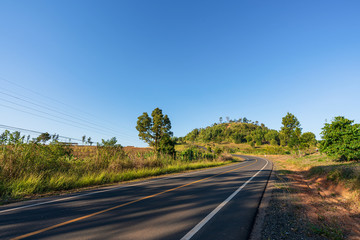 Fototapeta premium beautiful blue sky high peak mountains mist fog wildlife green forest at Khao Koh Phu Tub Berk Phetchabun Thailand guiding idea long weekend for backpacker camping campfire relaxing hiking 
