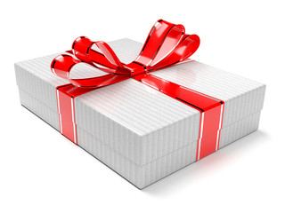 Gift box decorated with shiny red ribbon