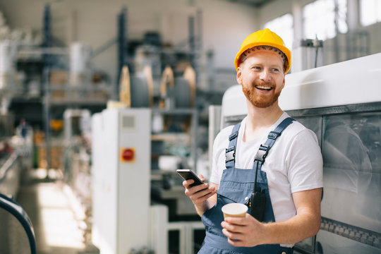 Factory worker on coffee break - Powered by Adobe