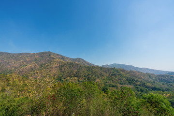 beautiful blue sky high peak mountains mist fog wildlife green forest at Khao Koh Phu Tub Berk Phetchabun Thailand guiding idea long weekend for backpacker camping campfire relaxing hiking  