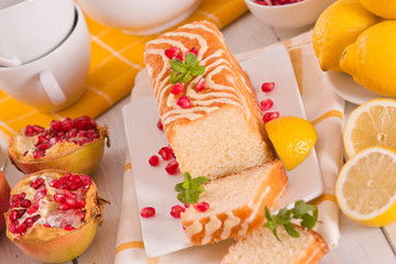 Lemon sponge cake with pomegranate.