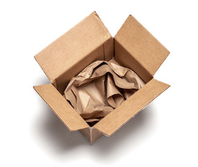 Open cardboard box with wrapping paper inside. Isolated on a white background. Top view. mock-up.
