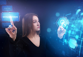 Business, Technology, Internet and network concept. Young businessman working on a virtual screen of the future and sees the inscription: SEO&AdWords