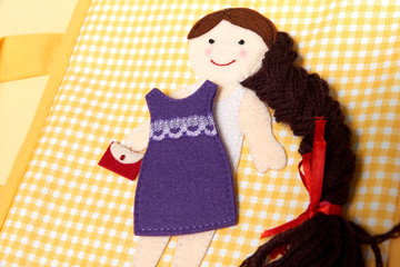 CHILDREN'S TEXTILE TRAINING . GIRL PLAYS WITH A PUPPET - DRESSES UP IN A DRESSES