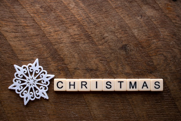the word Christmas on wood