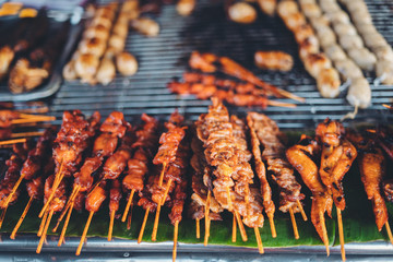 Fried and grilled foods at the street market in Pai © artrachen