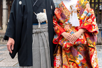 Detail of a japanese couple dressed in traditional costume