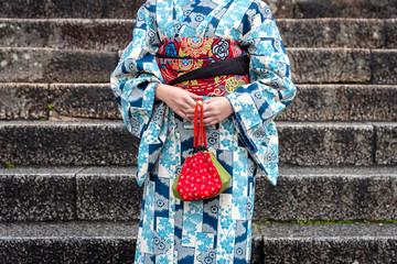 Detail of a japanese woman dressed in traditional costume