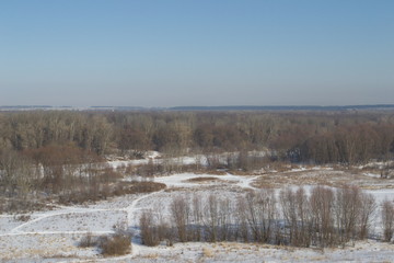 Winter landscape in forest and fields