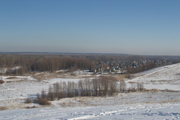 Winter landscape in forest and fields