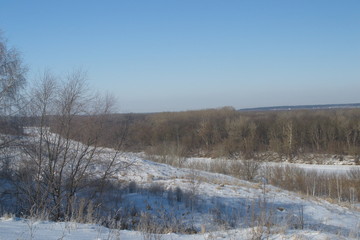 Winter landscape in forest and fields