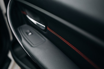 Leather panel with red line at the door panel