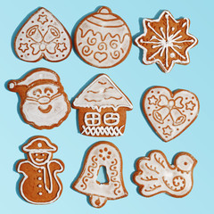 Handmade Christmas gingerbread on a blue background. New Year's concept. View from above