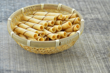 Vanilla waffle roll sticks in bamboo basket