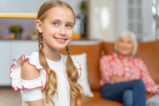 Young lady with pigtails posing for the camera