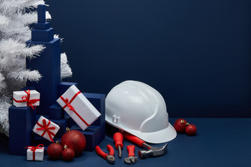 Construction tools, hard hat and Christmas decorations. Christmas and New Year construction