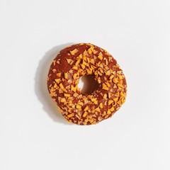 Appetizing sweet doughnut on a white background. I'm looking at it. close-up.