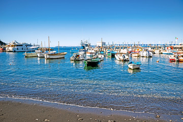 Boats on the black-sanded beach of Sorrento, Italy