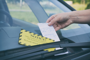 Parking ticket under windshield wiper