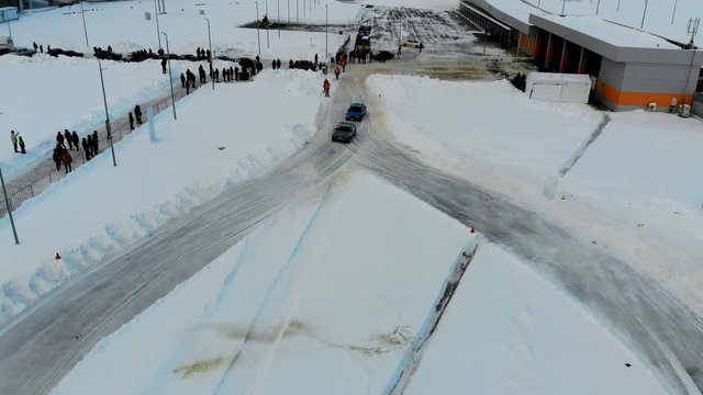 Aerial shot of winter drift competition on Russian Classics Lada VAZ-2107. Taken by drone