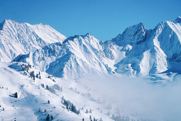 Fototapeta na wymiar Landscape in Zillertal Arena ski resort in clouds of Austria