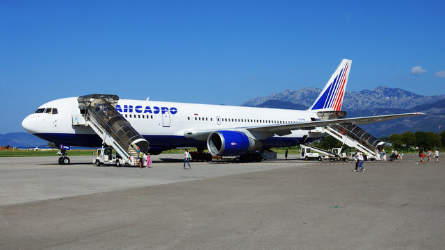 . Boeing-767 of the Russian airline "Transaero" to prepare for a departure from an airport Tivat on August 28, 2014. Boeing 767 is the most popular model of widebody long range airliners