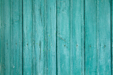 Fototapeta na wymiar blue-green colored wooden planks wall