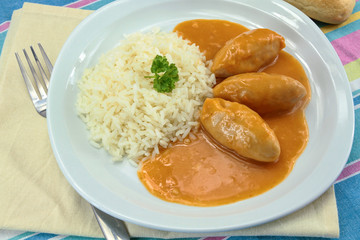 pike dumplings with nantua sauce on a plate