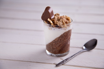 Delicious breakfast, cocoa chia pudding with yogurt and cereals