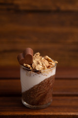 Delicious breakfast, cocoa chia pudding with yogurt and cereals