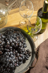 Red wine grape in dark metal tray.