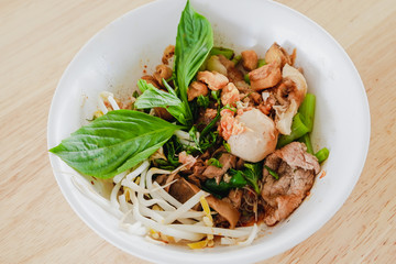 Thai noodle soup (Kuay Tiew Ruer) can choose either beef or pork. Serve with Basil, bean Sprouts. Noodle of traditional thai food. Very famous in Thailand.