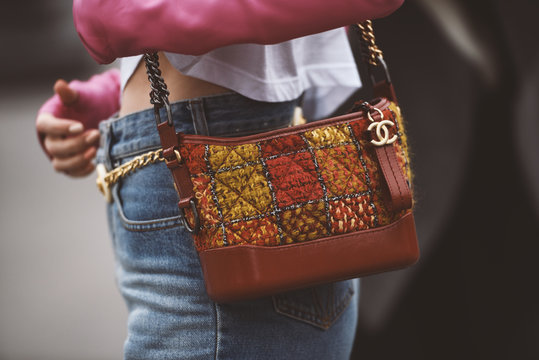 October 2, 2018: Paris, France - Girl wearing a stylish Chanel hand bag after a fashion show during Paris Fashion Week  - PFWSS19